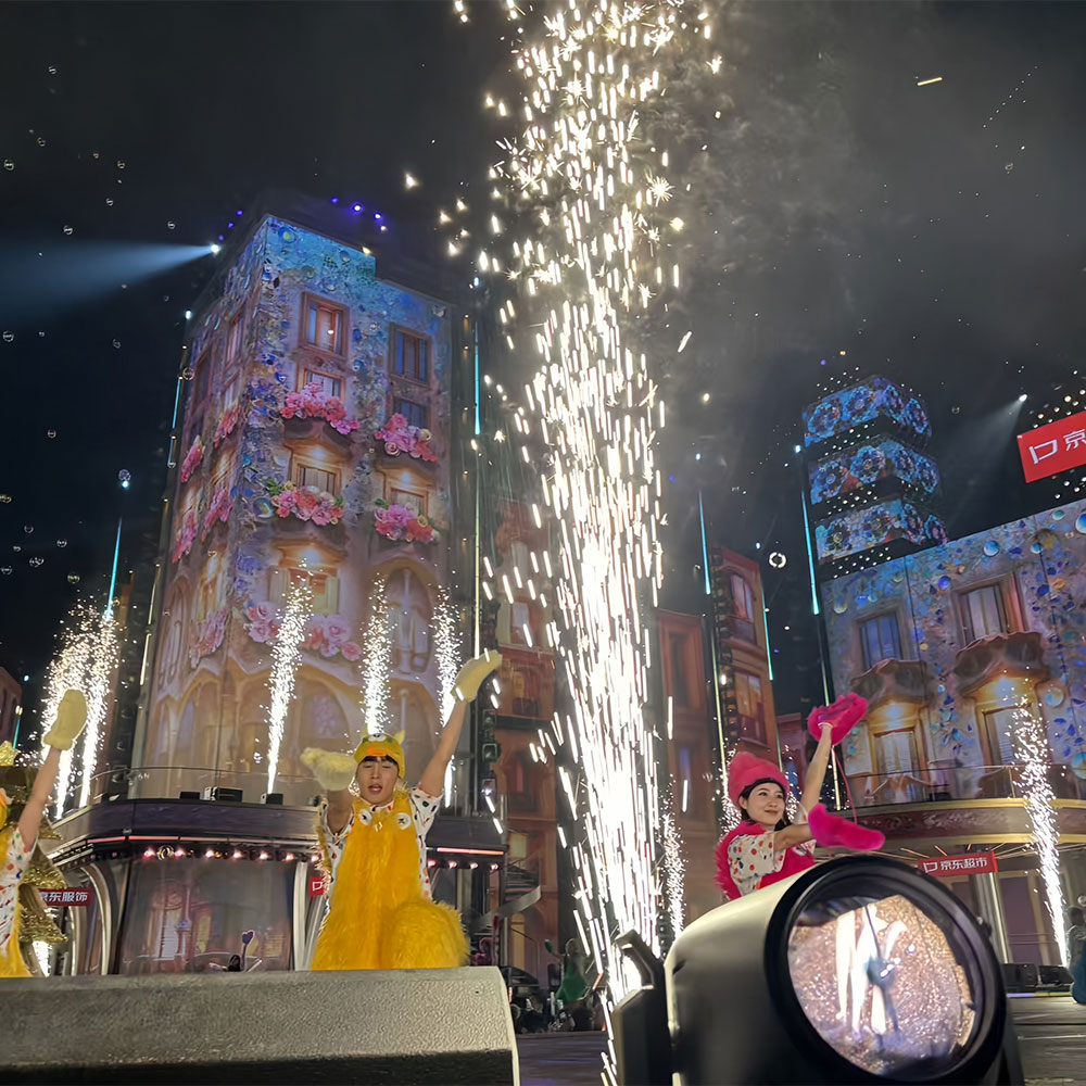 Outdoor stages show with a spark machine creating a firework effect.